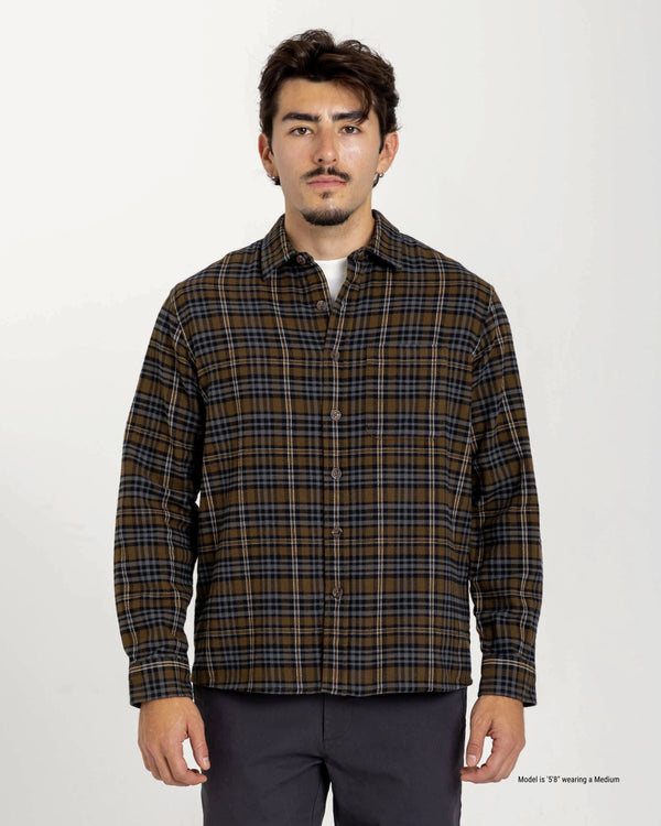 Short Man wearing a plaid shirt on a white background