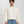 Load image into Gallery viewer, Short Man wearing a cream sweater and light blue jeans against a white background