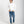 Load image into Gallery viewer, Man wearing a beige checkered shirt and dark jeans on a white background