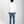 Load image into Gallery viewer, Short man wearing a beige checkered shirt and dark jeans on a white background