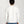 Load image into Gallery viewer, Person wearing a white long-sleeve shirt and blue jeans on a plain background