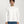 Load image into Gallery viewer, Man wearing a plain white long-sleeve shirt and blue jeans on a light gray background
