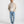 Load image into Gallery viewer, Short Man wearing a beige shirt, white t-shirt, light blue jeans, and white sneakers on a white background
