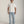 Load image into Gallery viewer, Man wearing a plain white t-shirt and light blue jeans on a gray background
